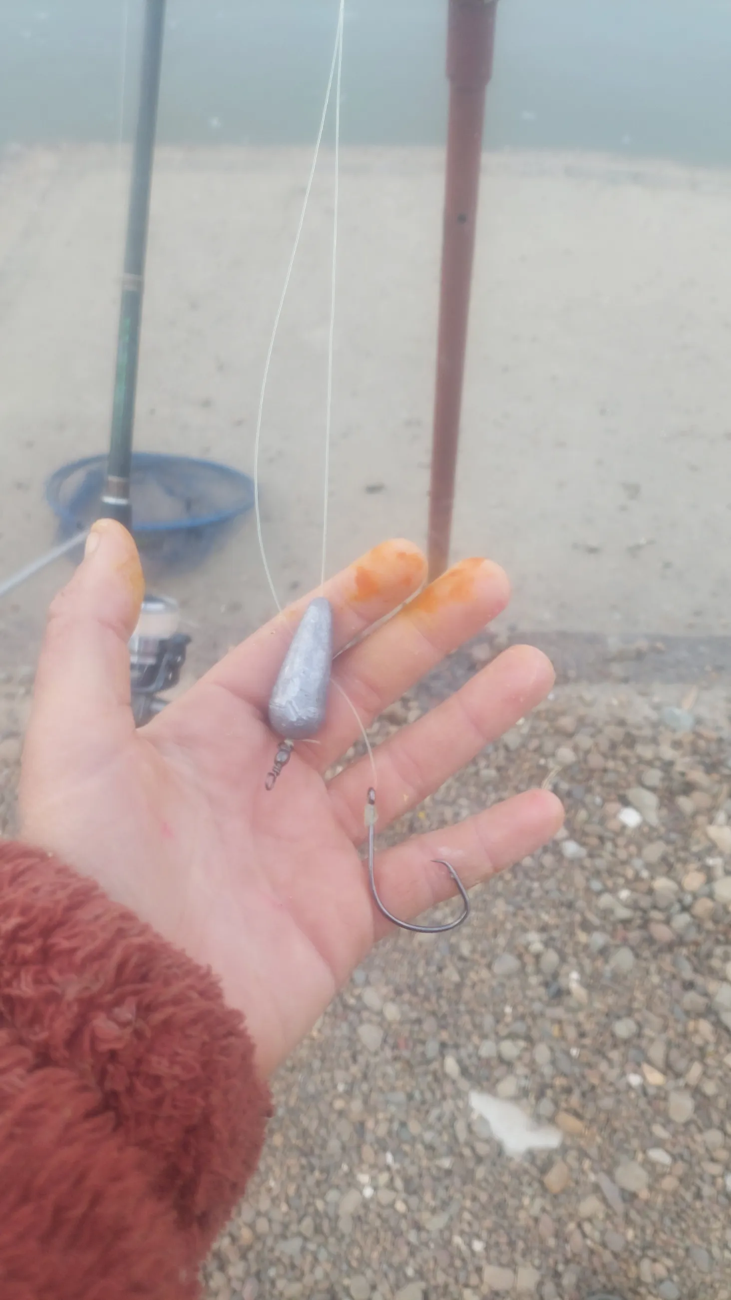 Dropper rig held in hand showing the weight separated from the hook